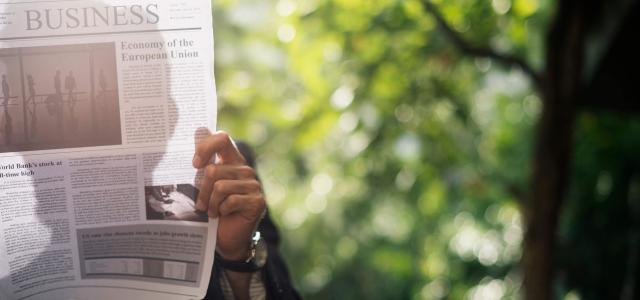Man reading newspaper